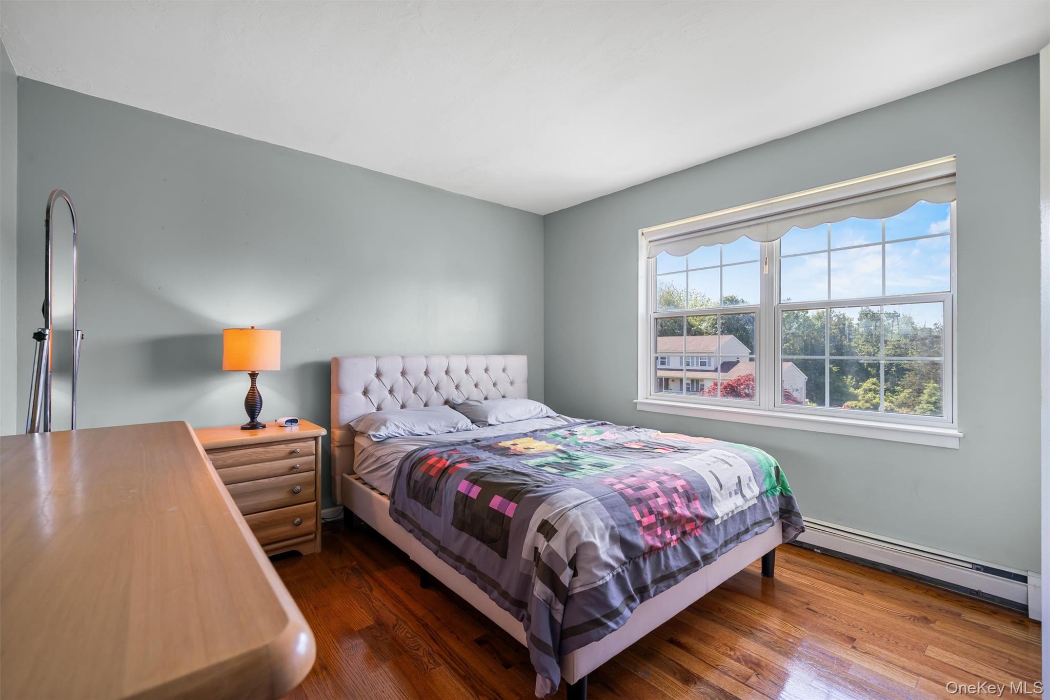 36 Lexington Drive Newburgh, NY 12550 - Photo 34 of 50 Bedroom with baseboard heating and wood finished floors