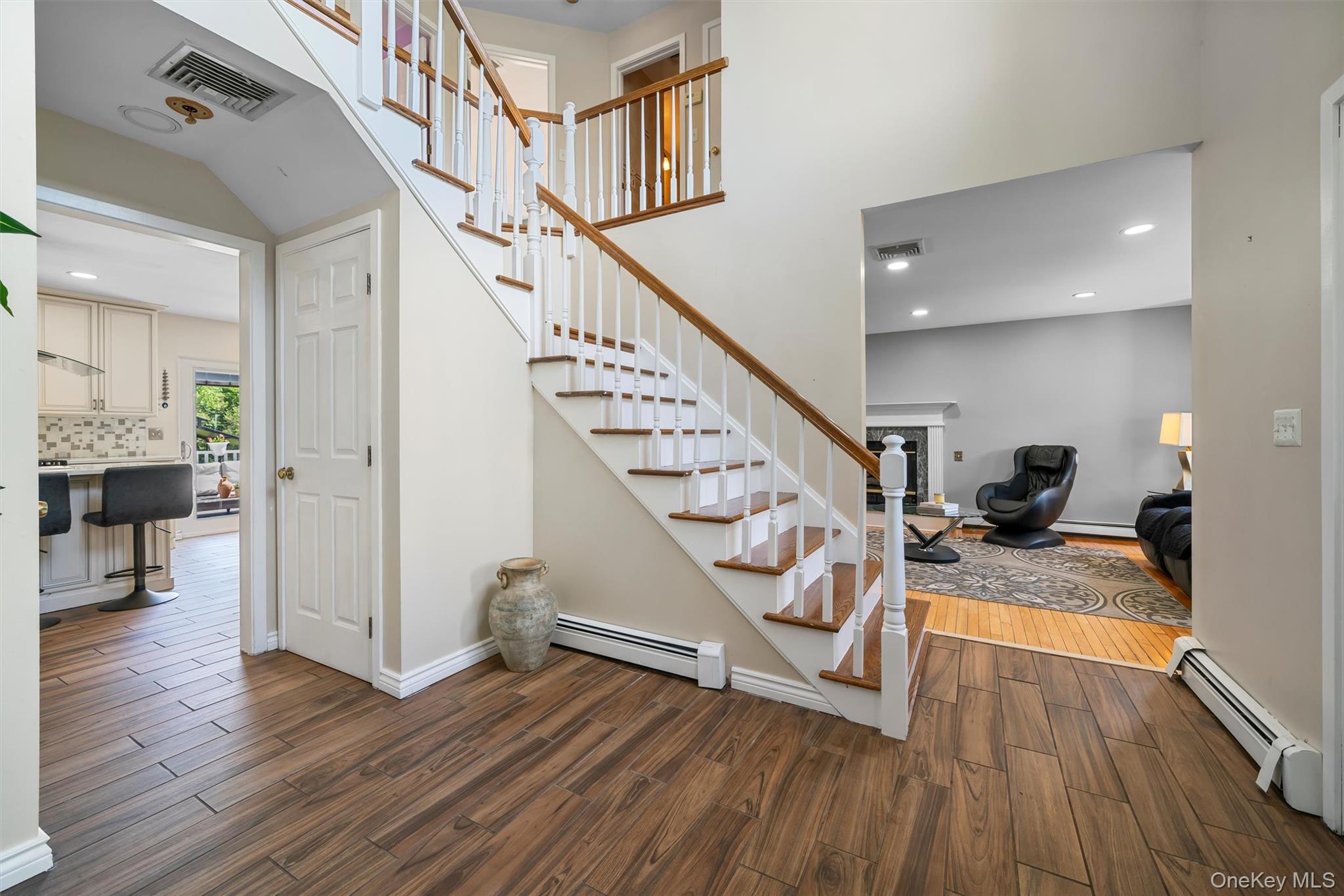 36 Lexington Drive Newburgh, NY 12550 - Photo 5 of 50 Stairs featuring a baseboard heating unit, wood finished floors, recessed lighting, and baseboards