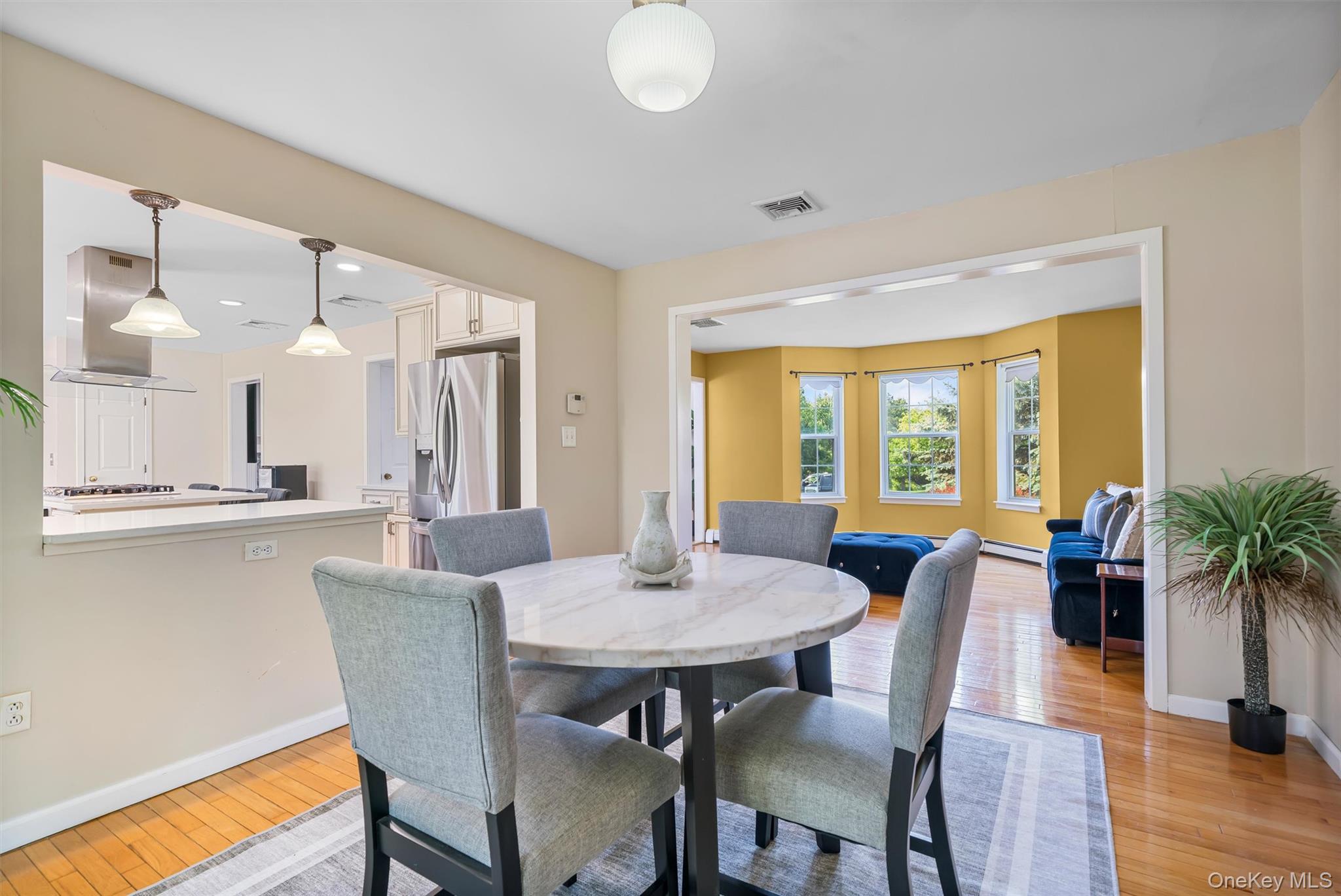 36 Lexington Drive Newburgh, NY 12550 - Photo 10 of 50 Dining room featuring light wood-style flooring, baseboards, and a baseboard radiator