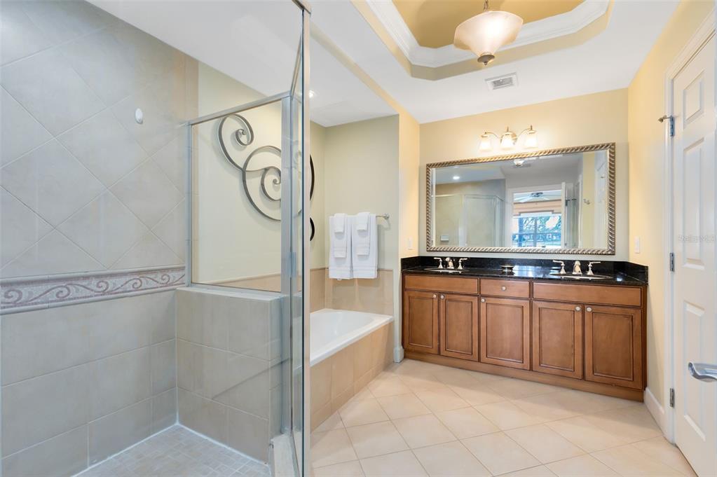 1360 Centre Ct Ridge Drive, Unit 201 Reunion, FL 34747 - Photo 14 of 29 a large bathroom with a mirror and a sink