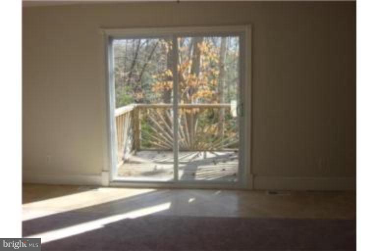 3511 Patuxent Road Huntingtown, MD 20639 - Photo 8 of 23 Master bedroom with deck overlooks backyard
