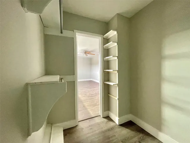 a bathroom with a shower and a sink