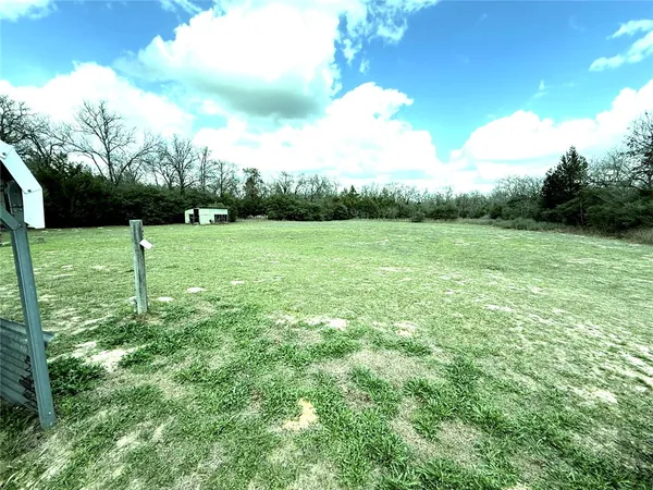 a view of field with lush green space