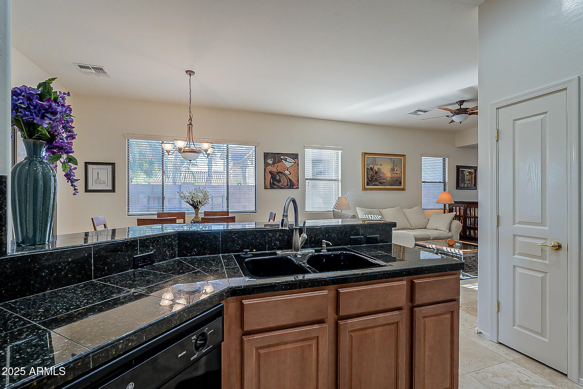 1857 West Periwinkle Way Chandler, AZ 85248 - Photo 11 of 38 a kitchen with a sink and cabinets