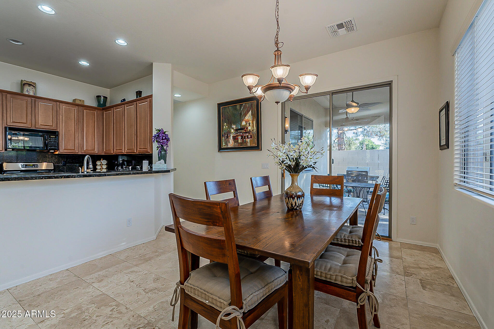 1857 West Periwinkle Way Chandler, AZ 85248 - Photo 14 of 38 a view of a dining room with furniture window and wooden floor