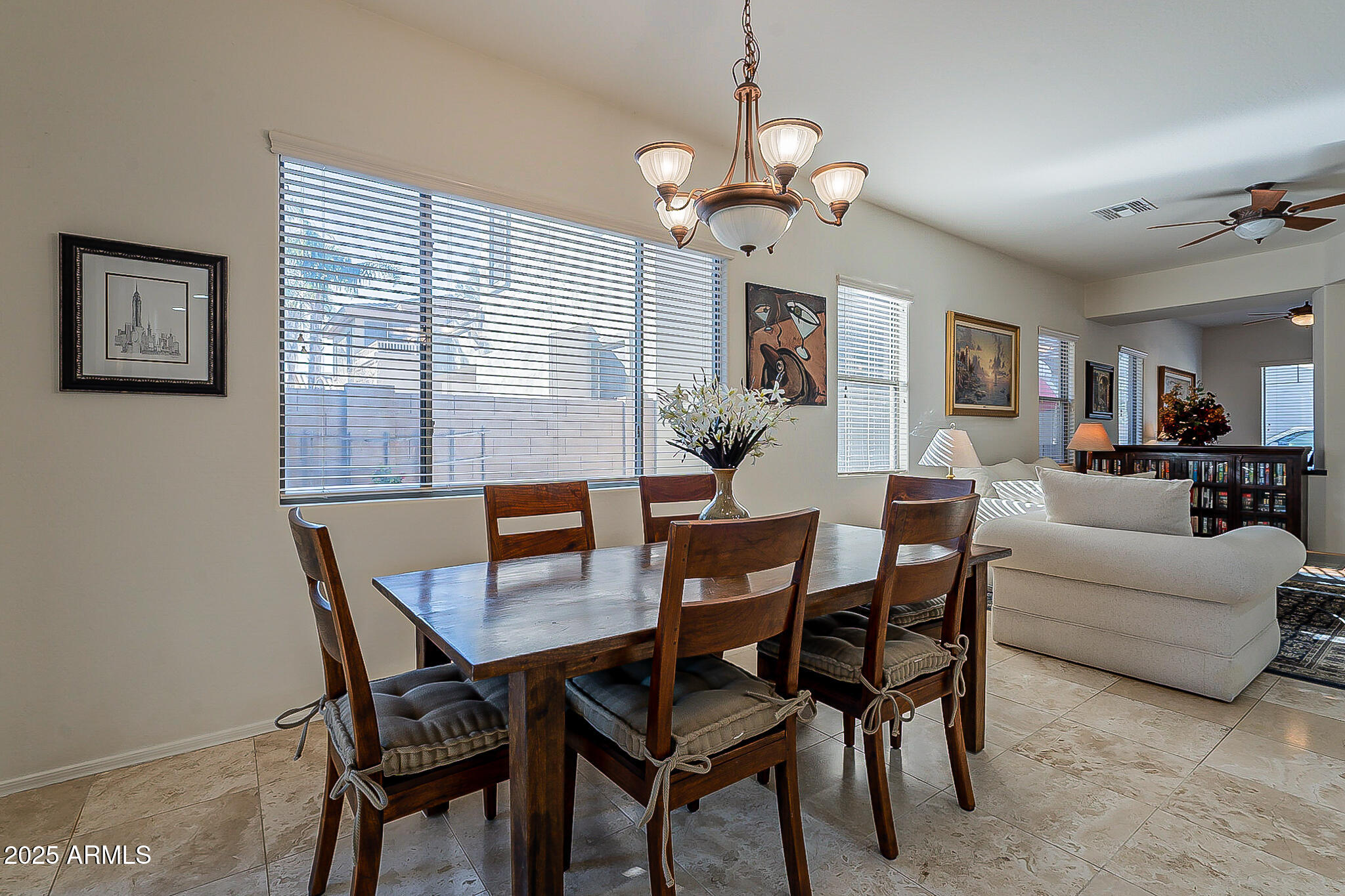 1857 West Periwinkle Way Chandler, AZ 85248 - Photo 15 of 38 a view of a dining room with furniture and chandelier