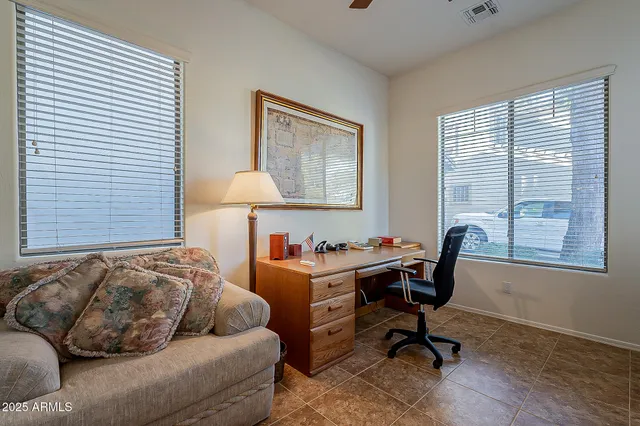 a living room with furniture and a window