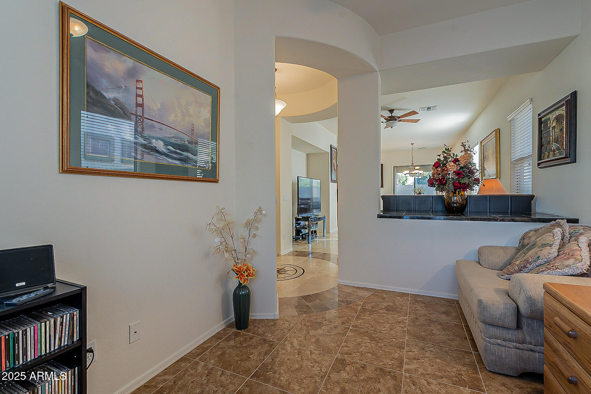 1857 West Periwinkle Way Chandler, AZ 85248 - Photo 18 of 38 a living room with furniture and a book shelf