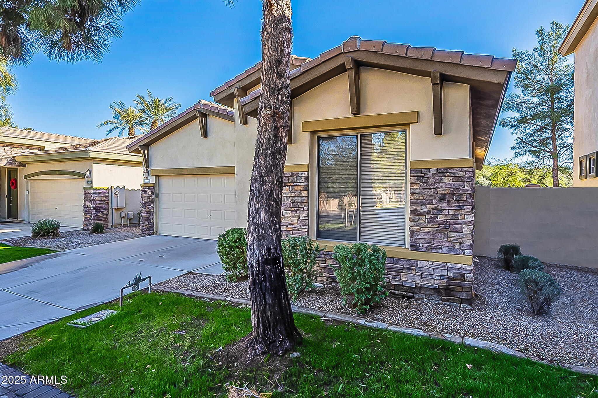 1857 West Periwinkle Way Chandler, AZ 85248 - Photo 2 of 38 a front view of a house with garden