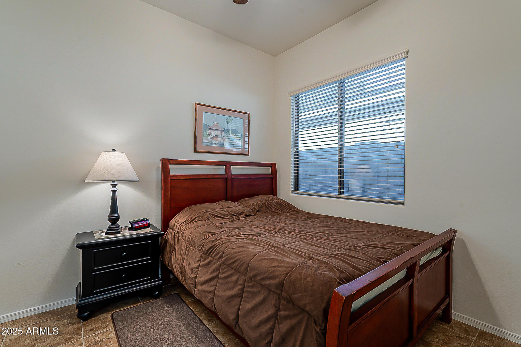 1857 West Periwinkle Way Chandler, AZ 85248 - Photo 28 of 38 a bedroom with a bed and a night stand