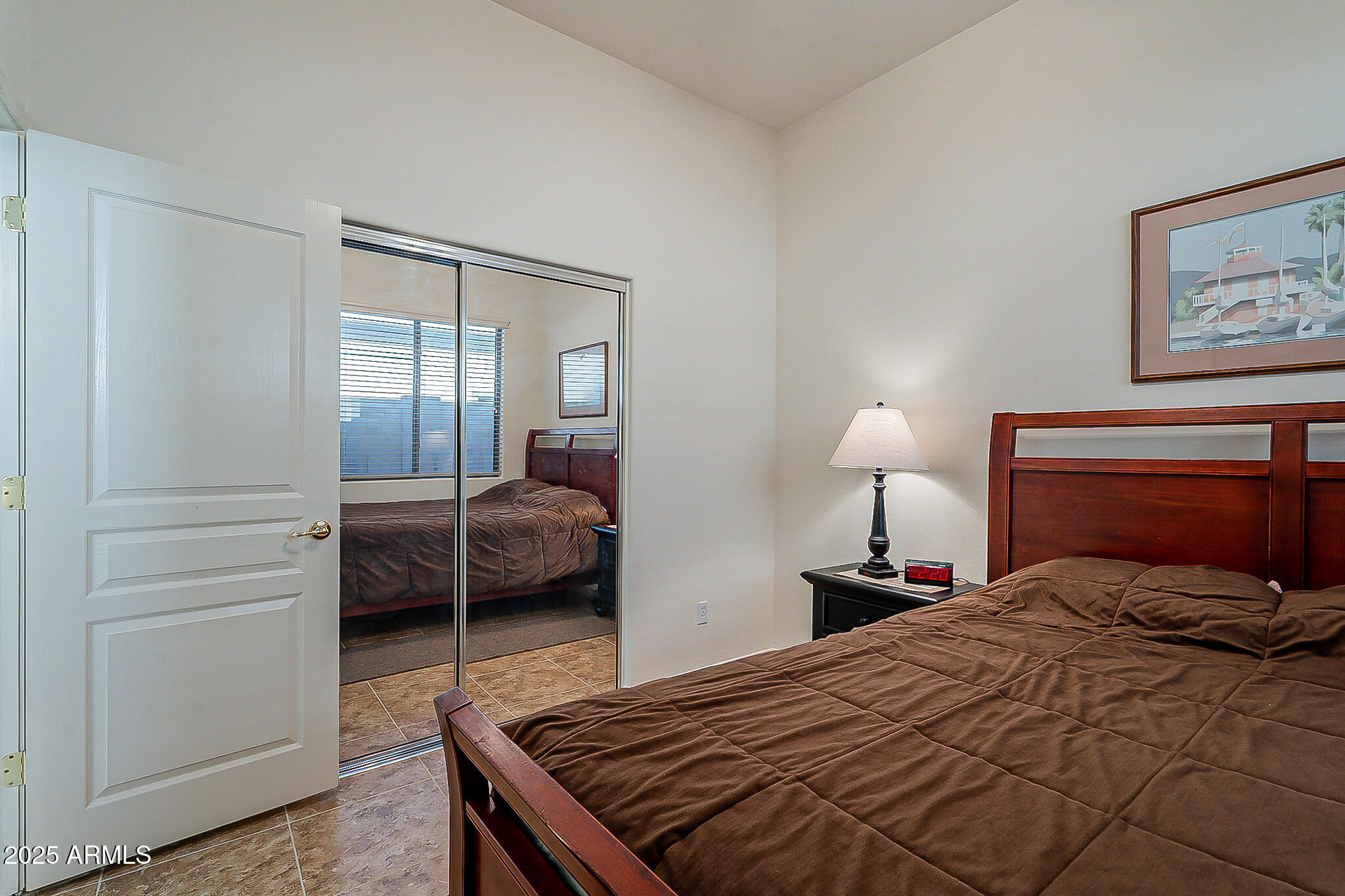 1857 West Periwinkle Way Chandler, AZ 85248 - Photo 29 of 38 a bedroom with a bed and a lamp