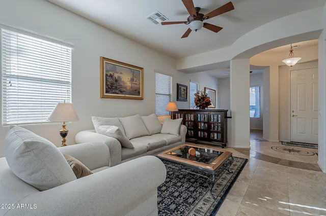 a living room with furniture and a rug