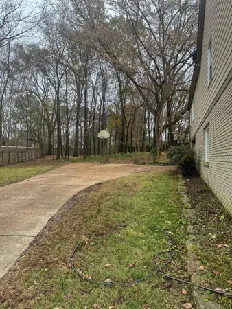 a backyard of a house with lots of green space