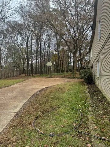 a backyard of a house with lots of green space