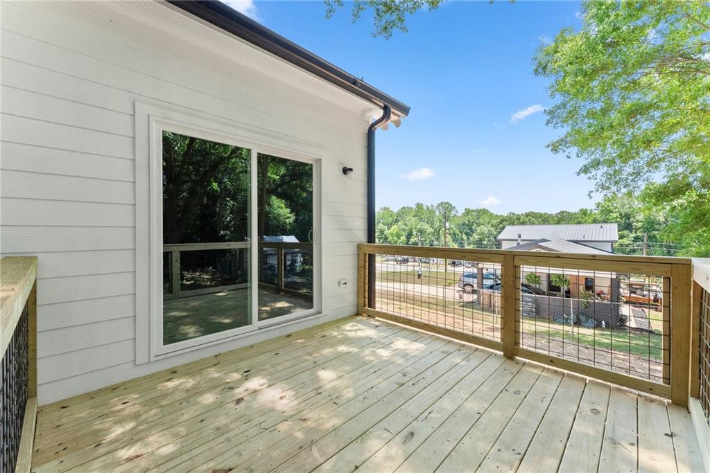 43 Anderson Street Jefferson, GA 30549 - Photo 34 of 45 a view of a balcony with wooden floor