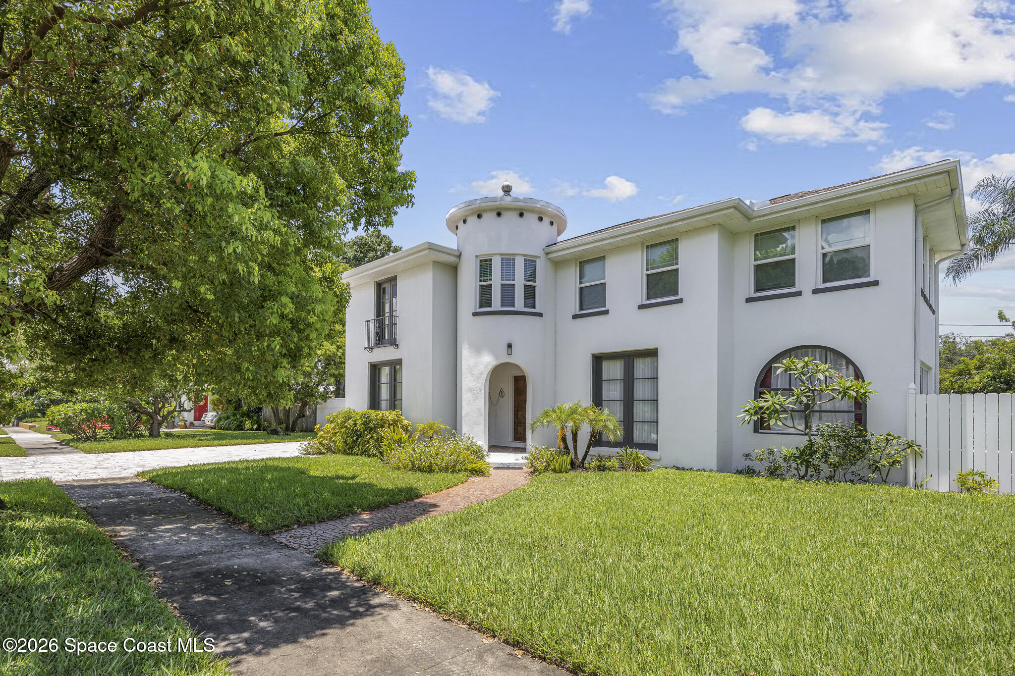 130 Valencia Road Rockledge, FL 32955 - Photo 1 of 72 a front view of a house with garden