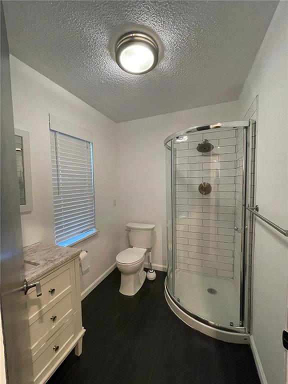4416 Chowning Way Atlanta, GA 30338 - Photo 11 of 17 a bathroom with a shower a toilet and a sink