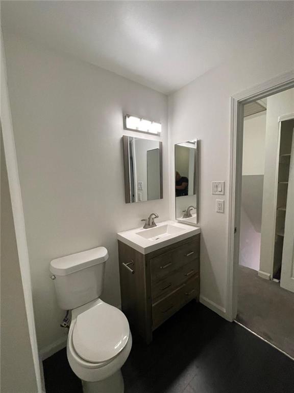 4416 Chowning Way Atlanta, GA 30338 - Photo 13 of 17 a bathroom with a toilet sink and mirror