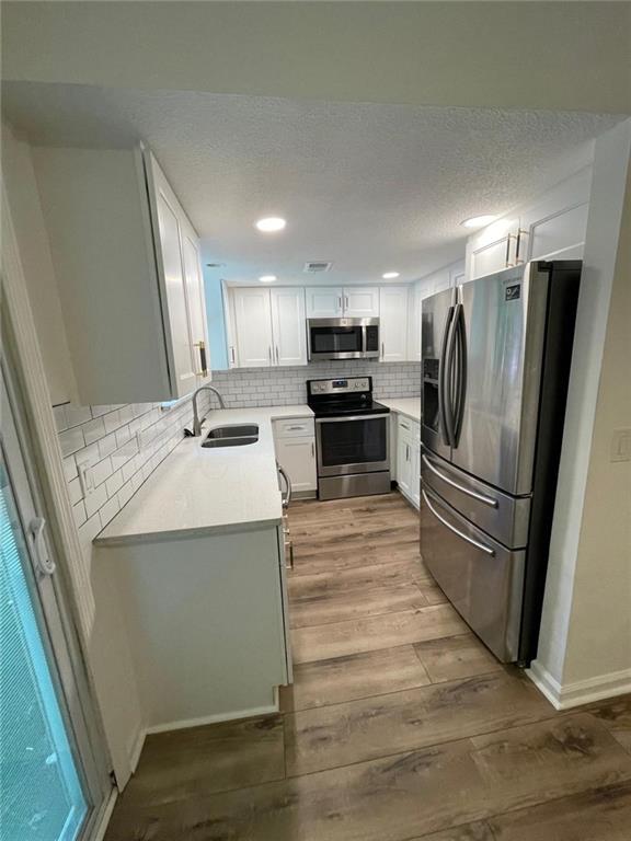 4416 Chowning Way Atlanta, GA 30338 - Photo 6 of 17 a kitchen with a refrigerator sink and microwave