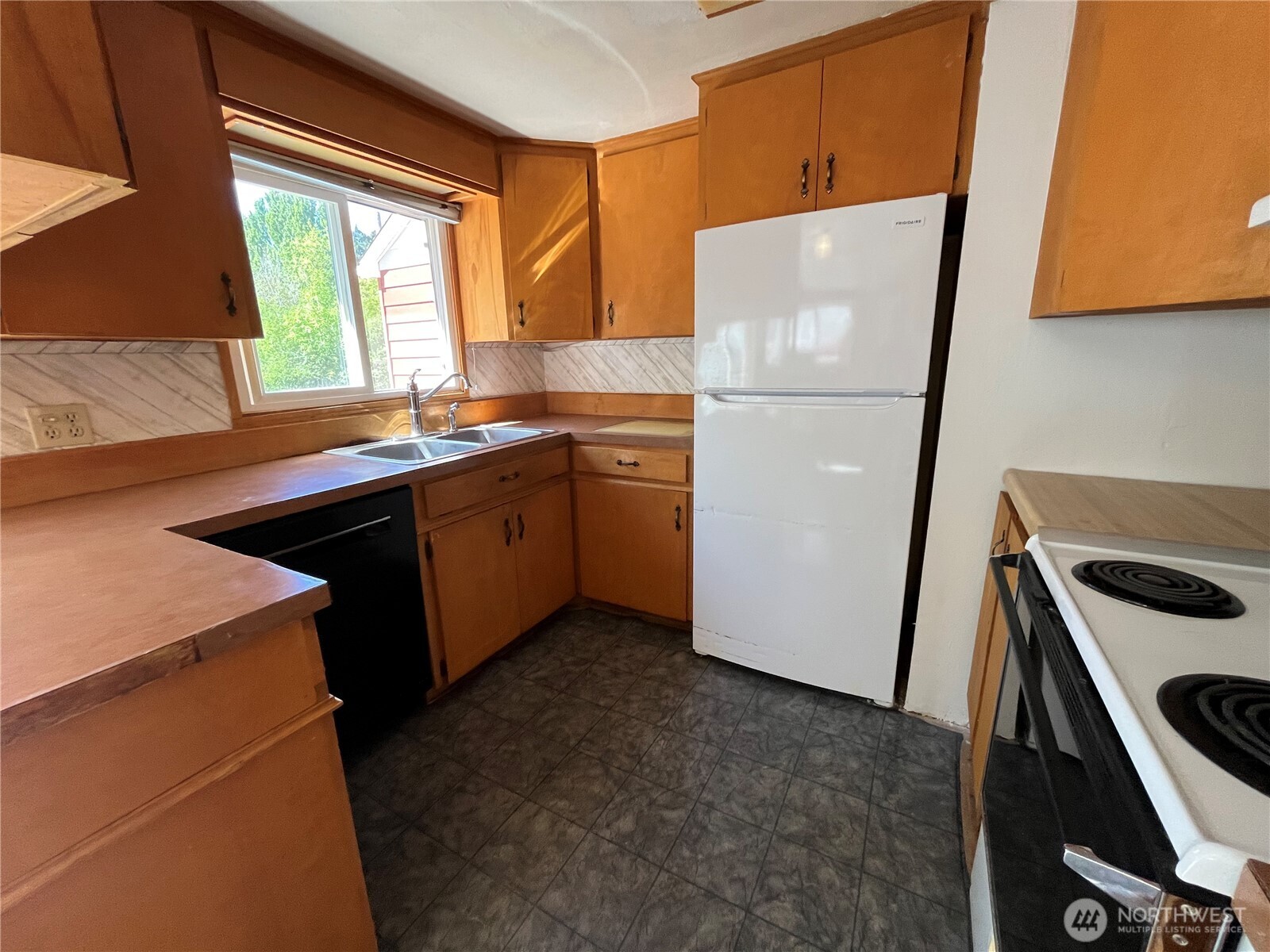 80 Southeast Channel Point Road Shelton, WA 98584 - Photo 12 of 26 a kitchen with a refrigerator sink and window