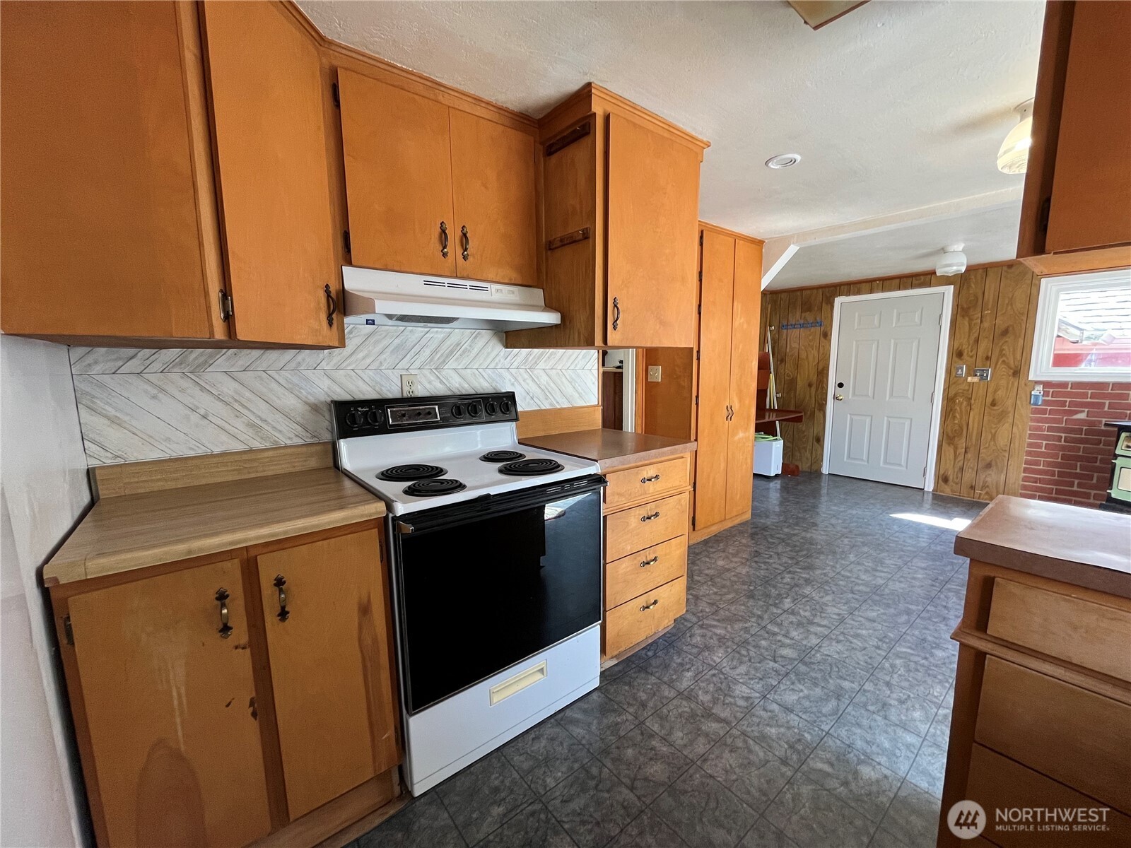 80 Southeast Channel Point Road Shelton, WA 98584 - Photo 13 of 26 a kitchen with stainless steel appliances granite countertop a stove a sink and a refrigerator