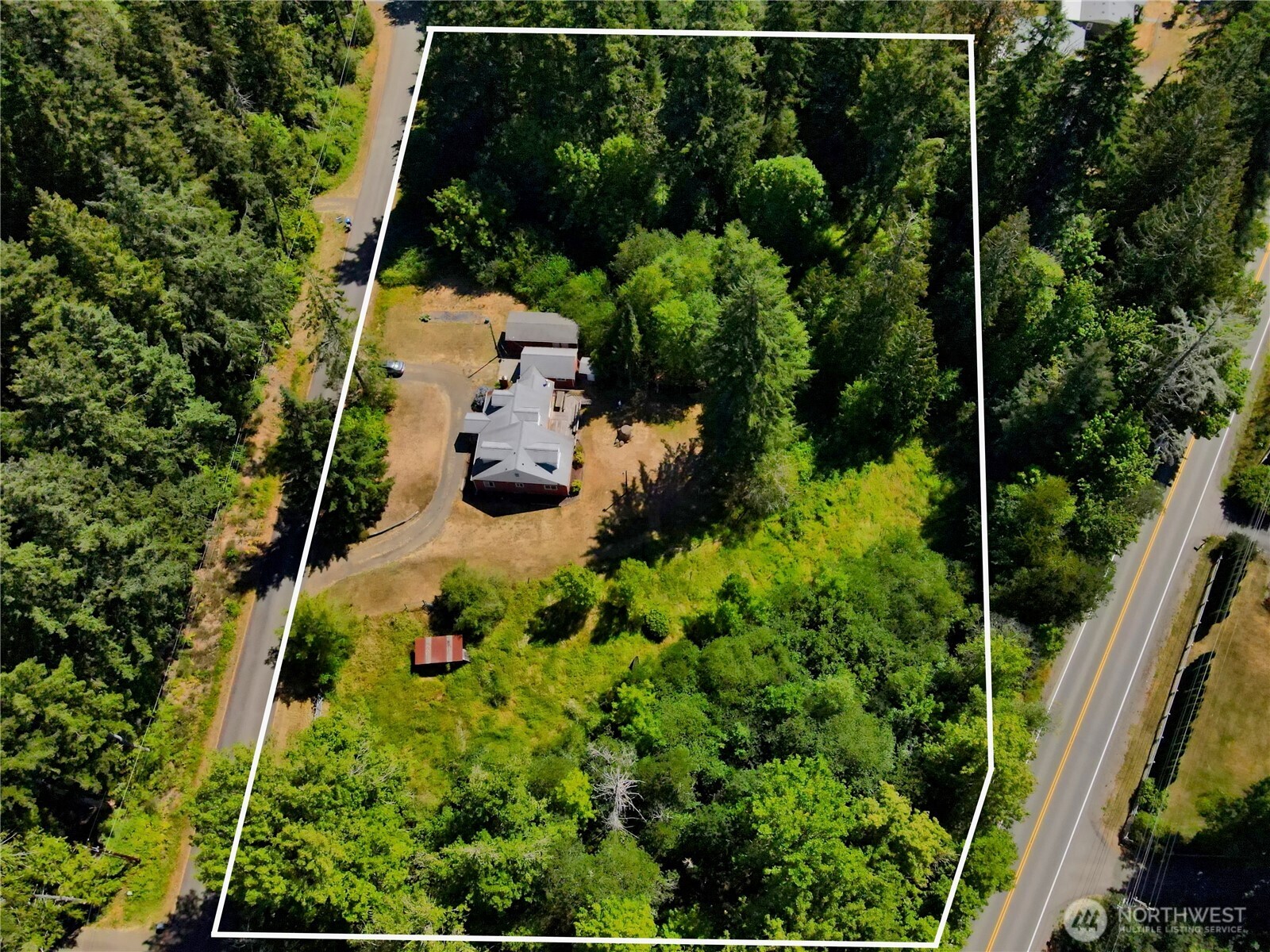 80 Southeast Channel Point Road Shelton, WA 98584 - Photo 2 of 26 an aerial view of a house with a yard