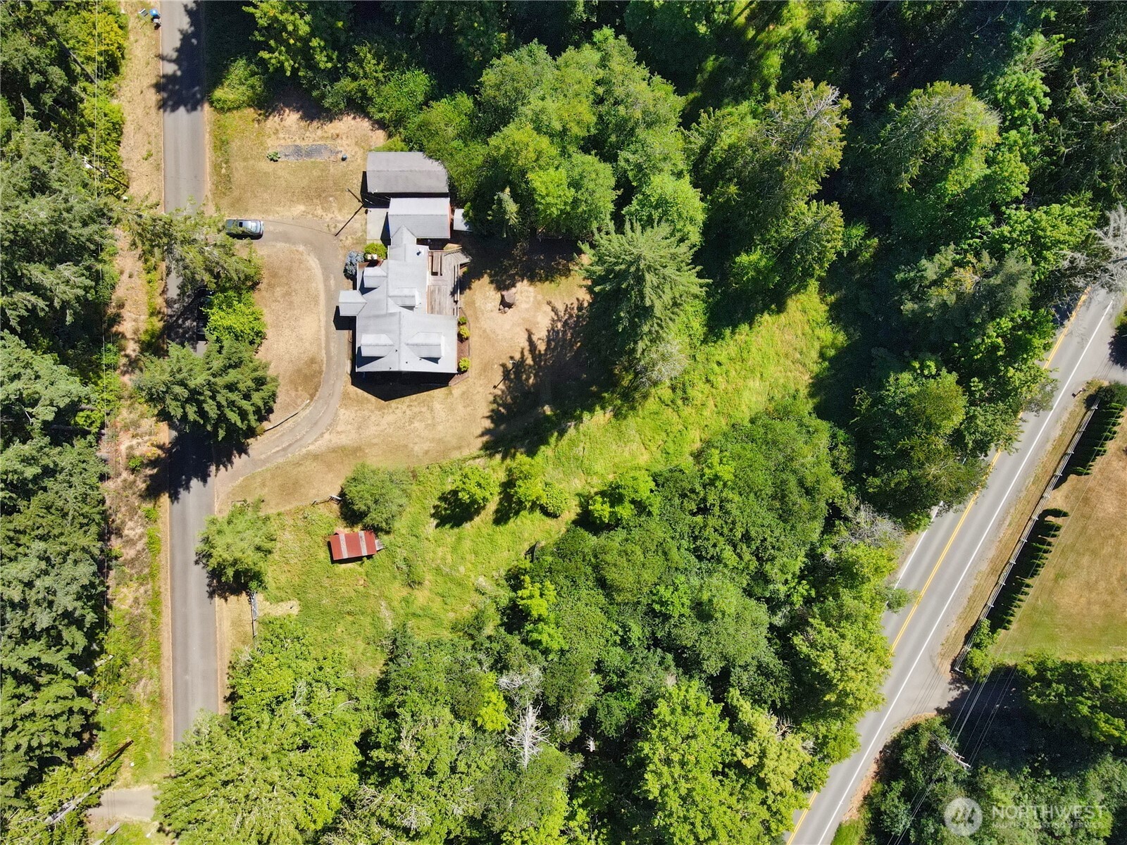 80 Southeast Channel Point Road Shelton, WA 98584 - Photo 23 of 26 an aerial view of a house with a yard