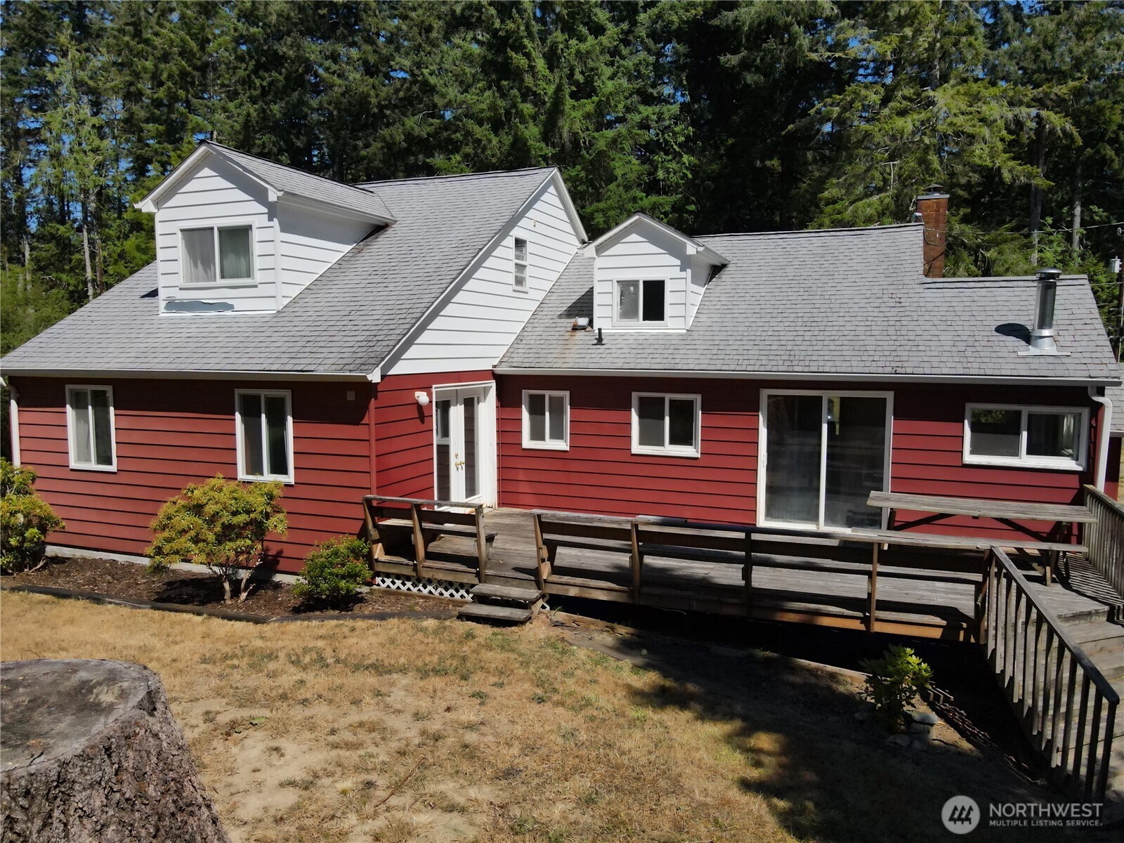 80 Southeast Channel Point Road Shelton, WA 98584 - Photo 4 of 26 a front view of a house with a yard