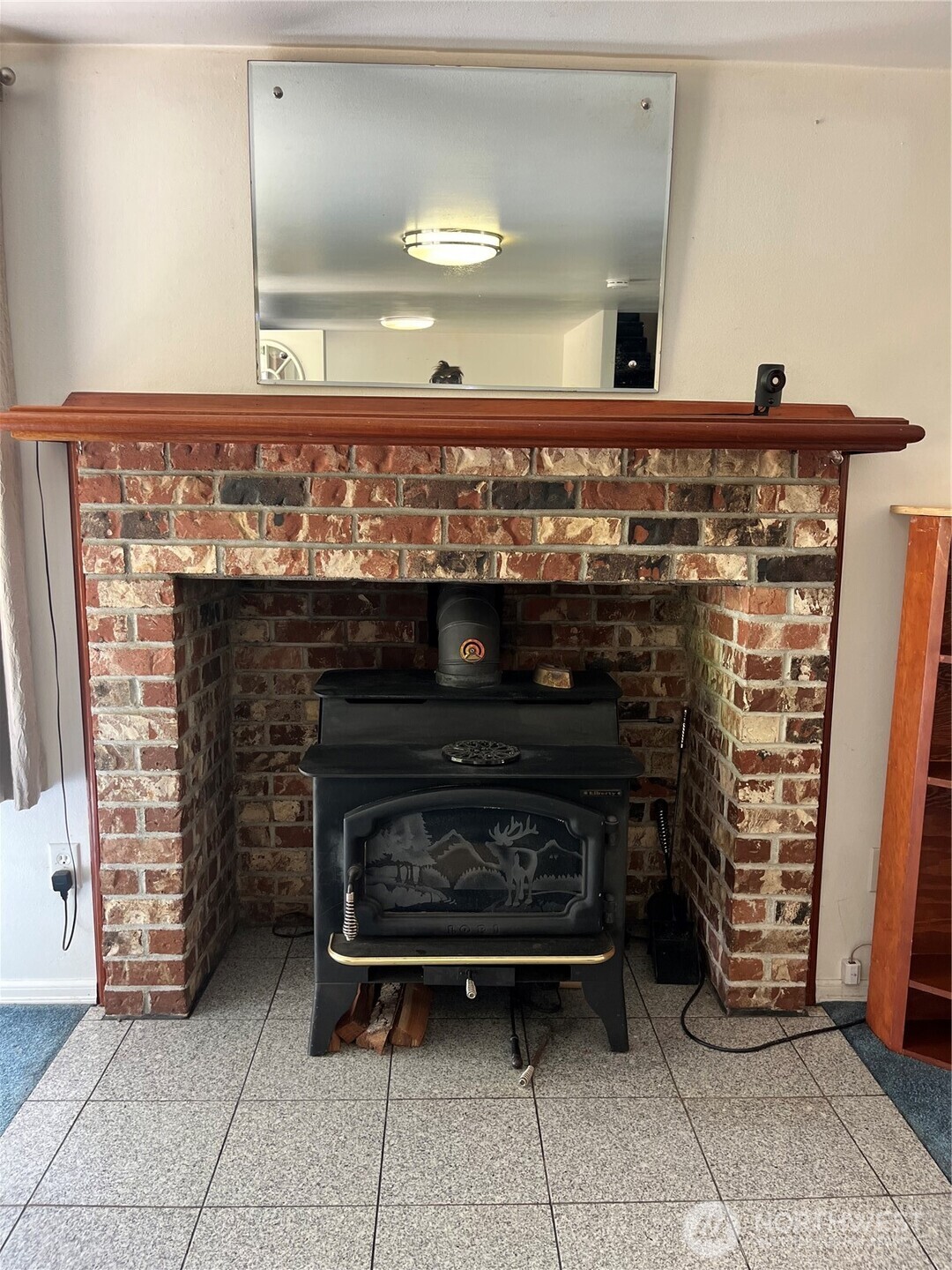 80 Southeast Channel Point Road Shelton, WA 98584 - Photo 7 of 26 a close view of a fireplace in an empty room