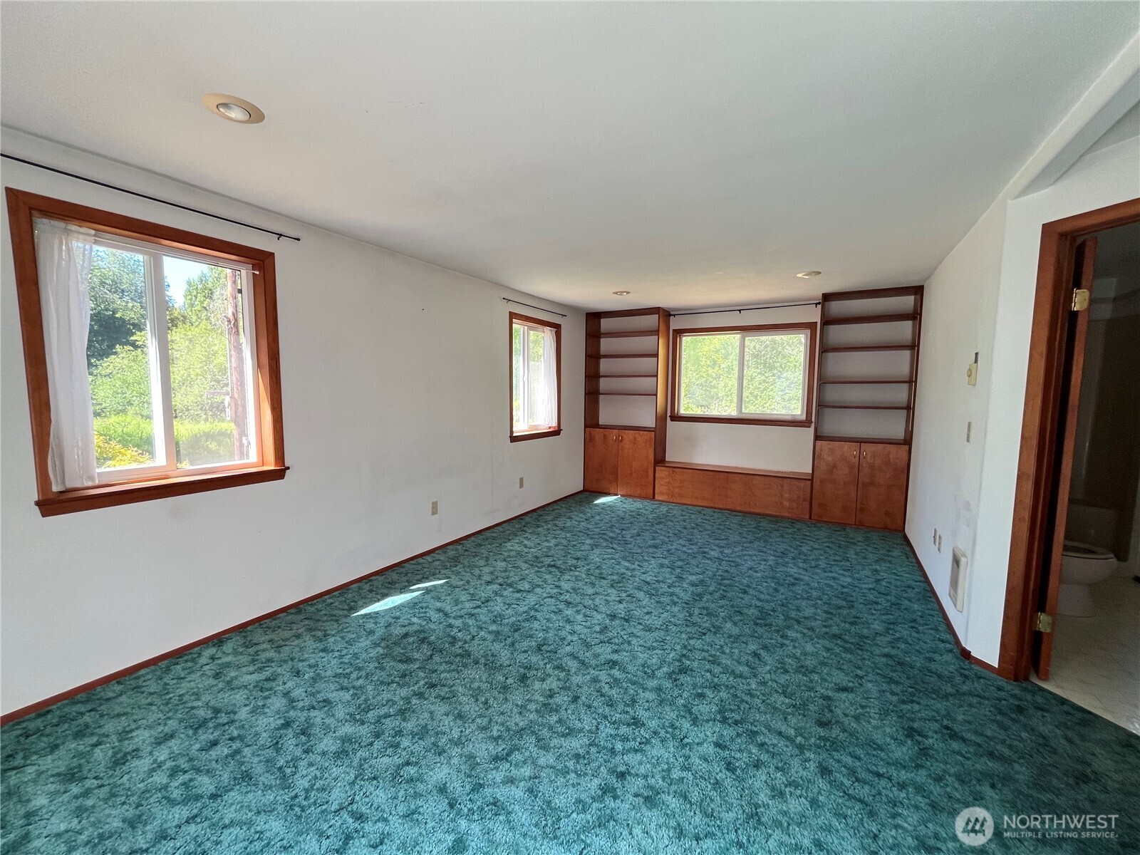 80 Southeast Channel Point Road Shelton, WA 98584 - Photo 8 of 26 an empty room with windows