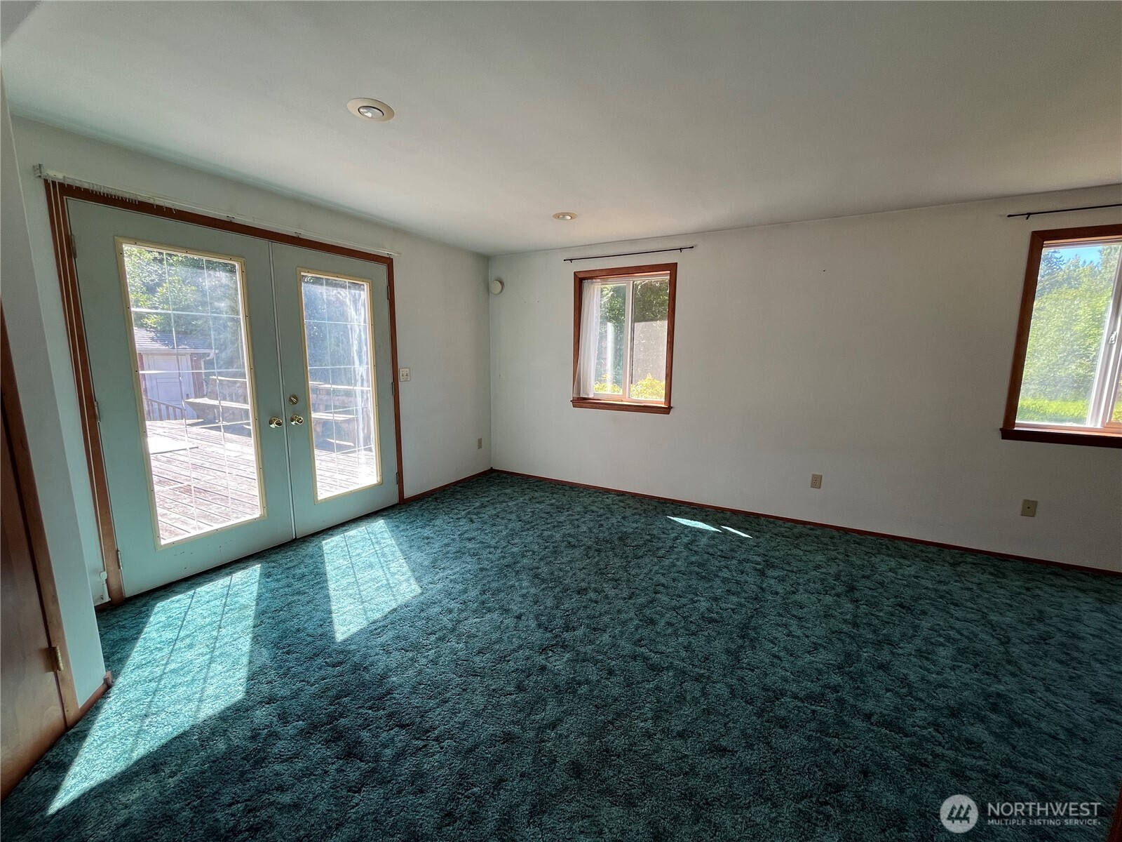 80 Southeast Channel Point Road Shelton, WA 98584 - Photo 9 of 26 a view of an empty room with a window