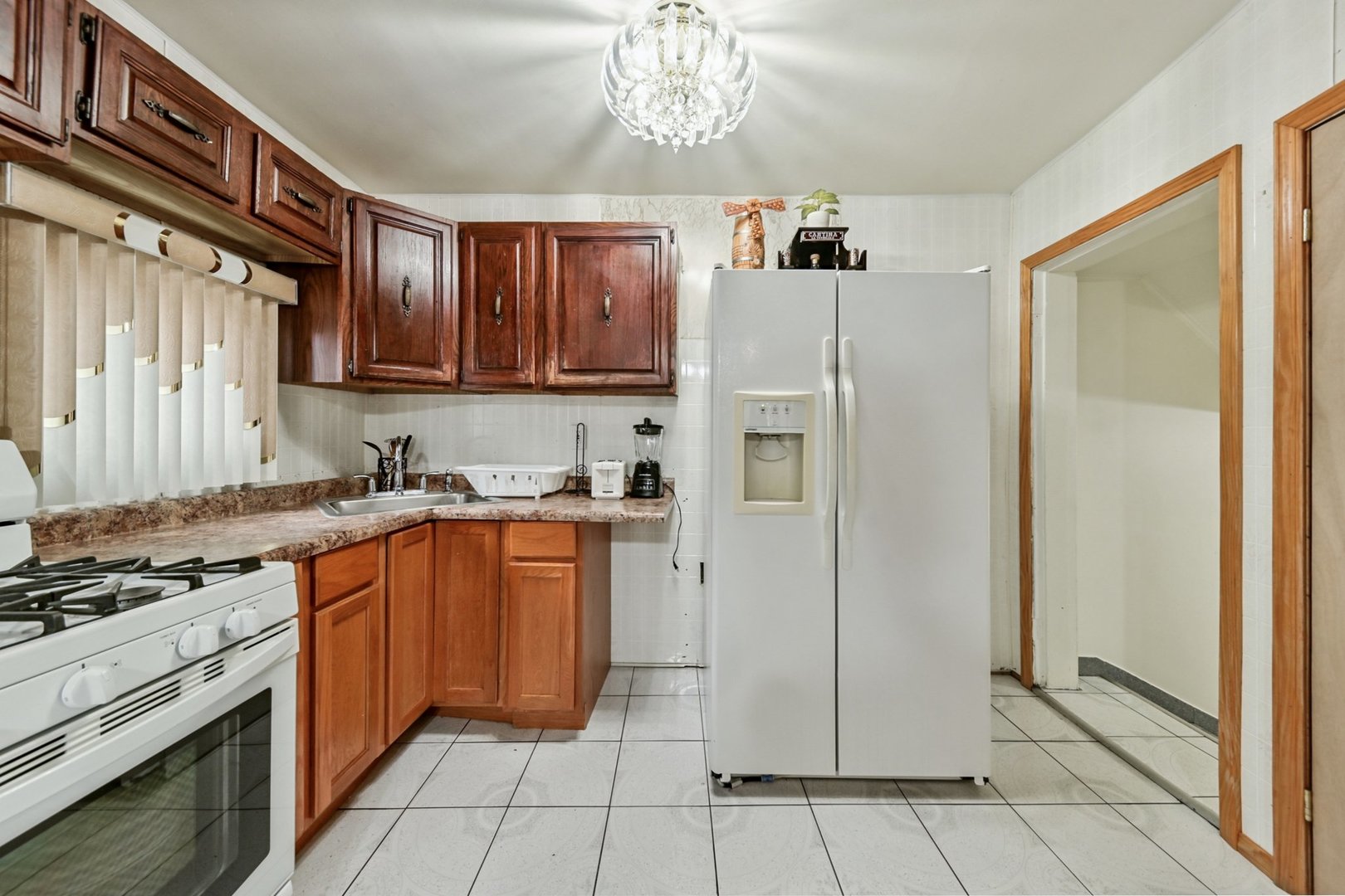 5536 South Normandy Avenue Chicago, IL 60638 - Photo 12 of 25 a kitchen with stainless steel appliances granite countertop a refrigerator and a sink