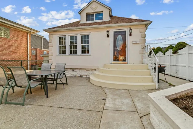 a view of a brick building next to a yard