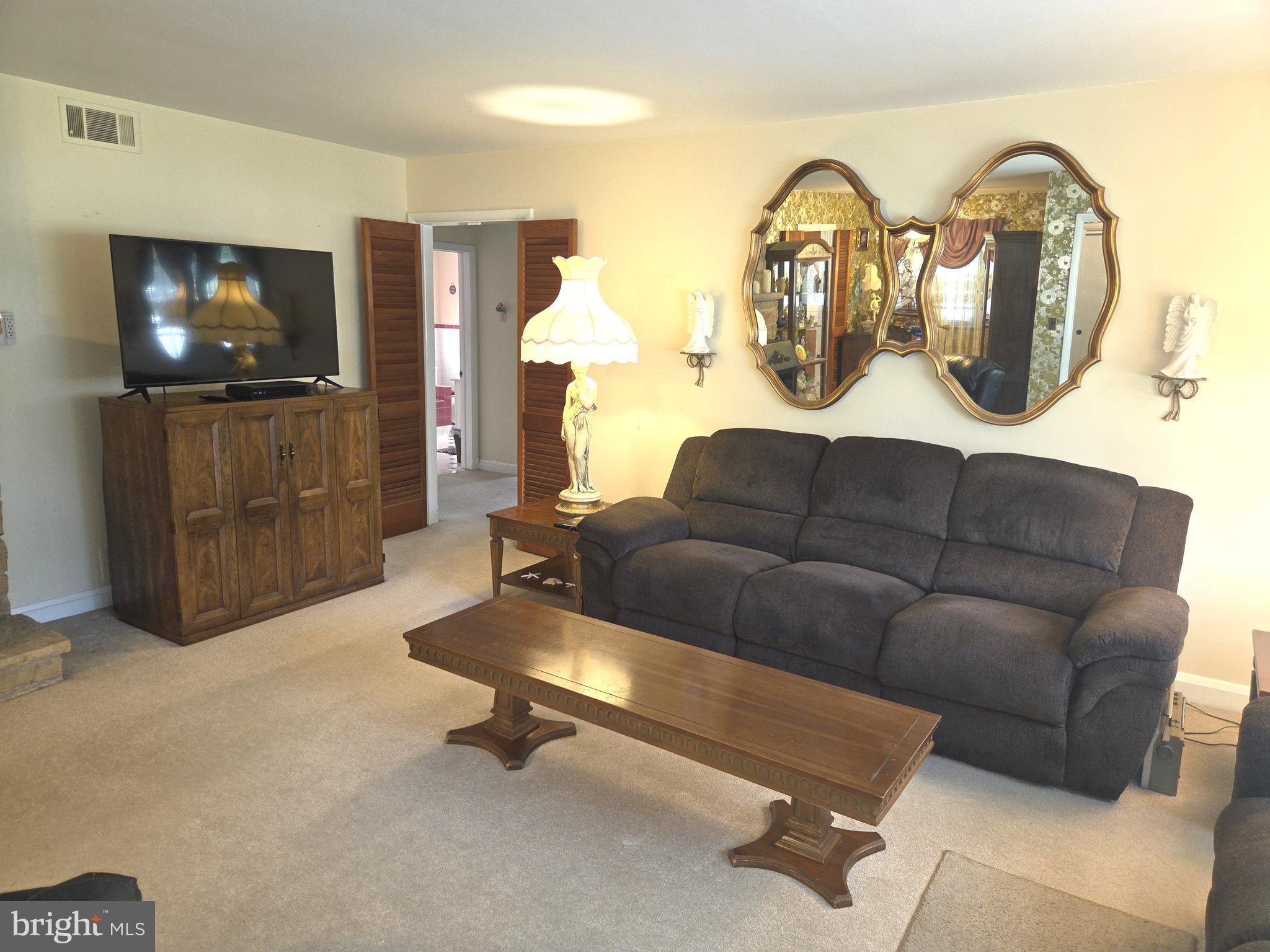 305 Bowleys Quarters Road Middle River, MD 21220 - Photo 23 of 55 a living room with furniture and a flat screen tv