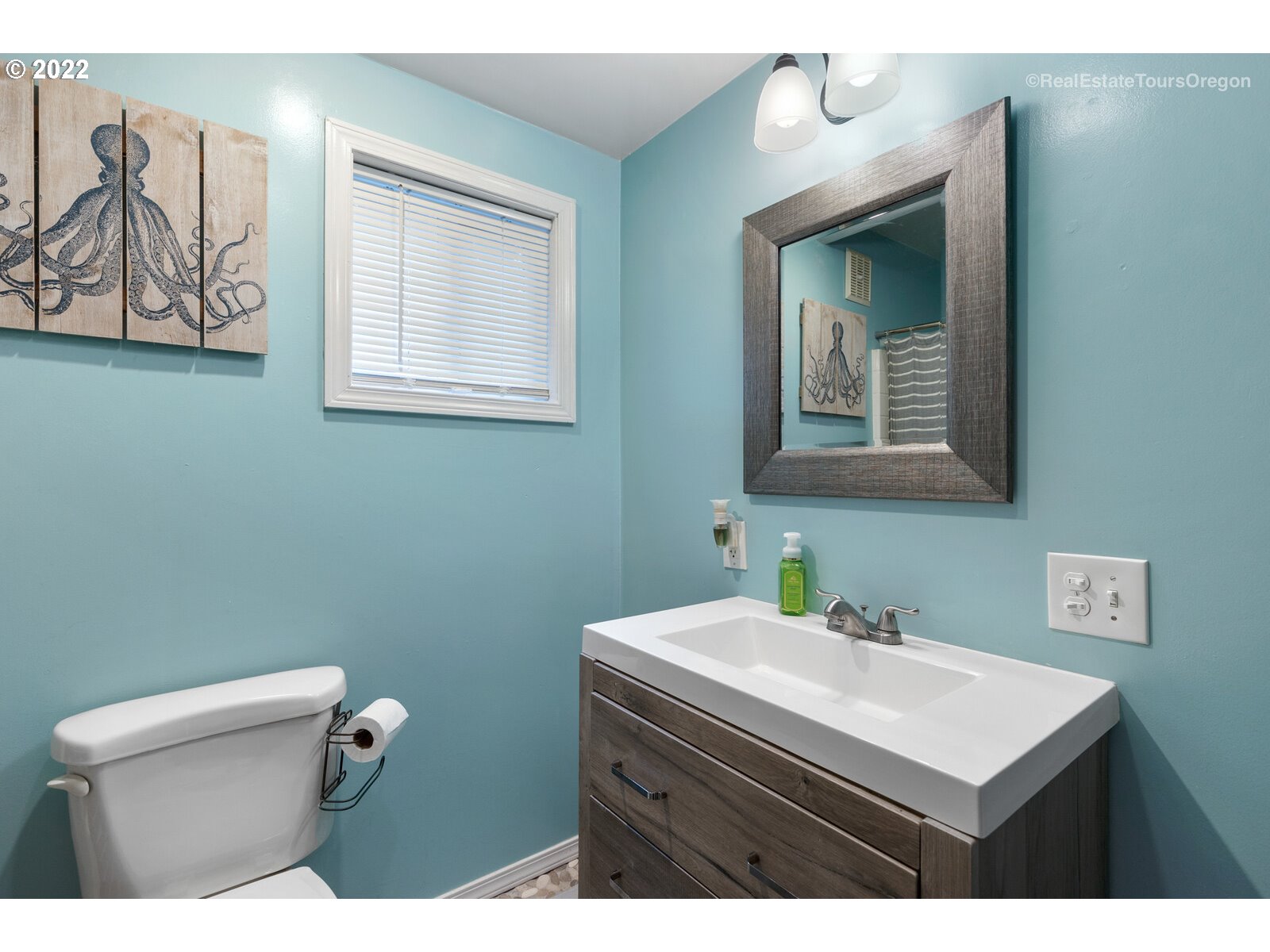 19465 Southeast Summertime Drive Sandy, OR 97055 - Photo 13 of 27 a bathroom with a sink mirror and toilet