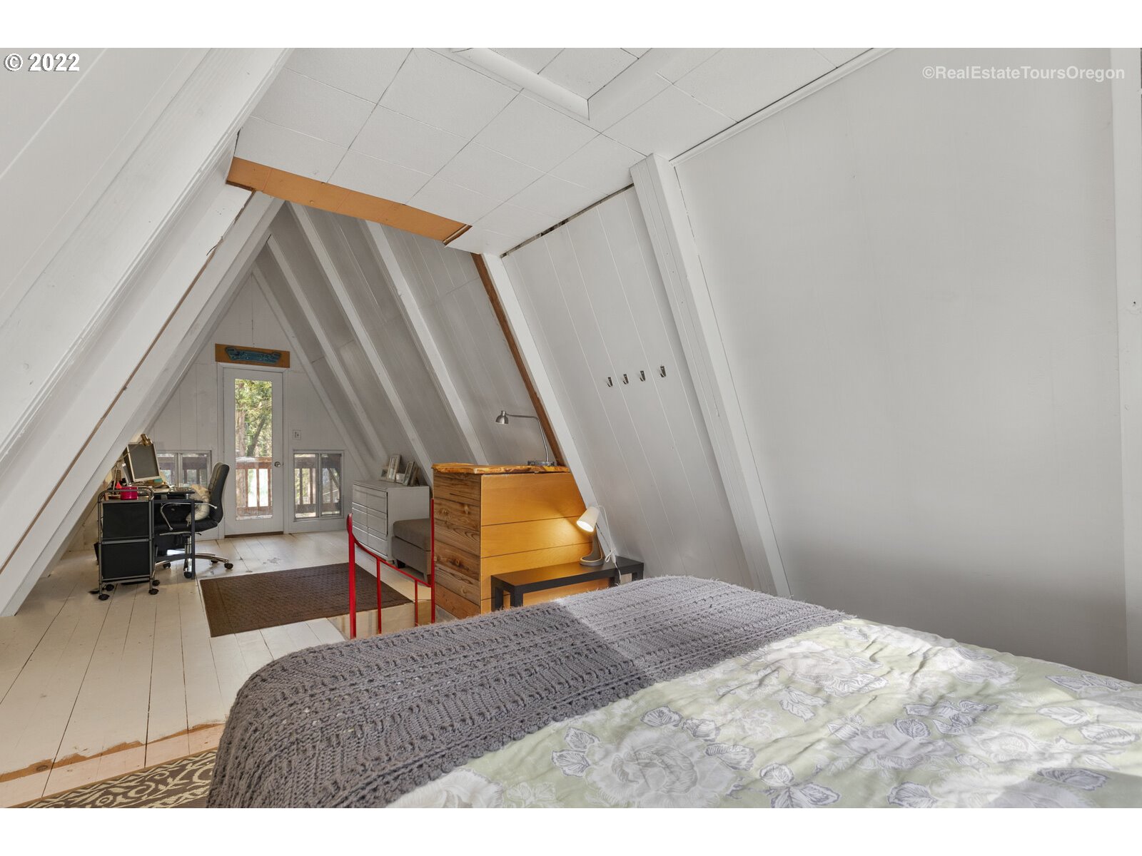 19465 Southeast Summertime Drive Sandy, OR 97055 - Photo 19 of 27 a bedroom with a bed and wooden floor