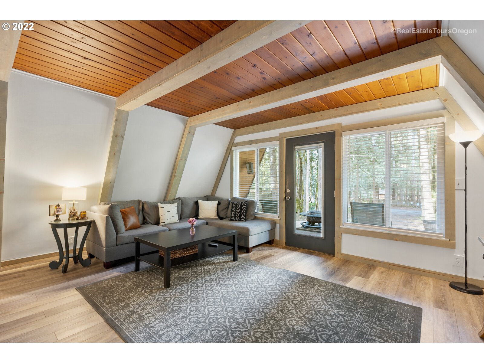 19465 Southeast Summertime Drive Sandy, OR 97055 - Photo 7 of 27 a living room with furniture and large windows