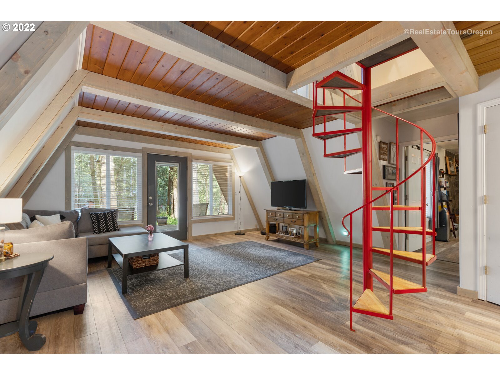 19465 Southeast Summertime Drive Sandy, OR 97055 - Photo 8 of 27 a living room with furniture and a flat screen tv
