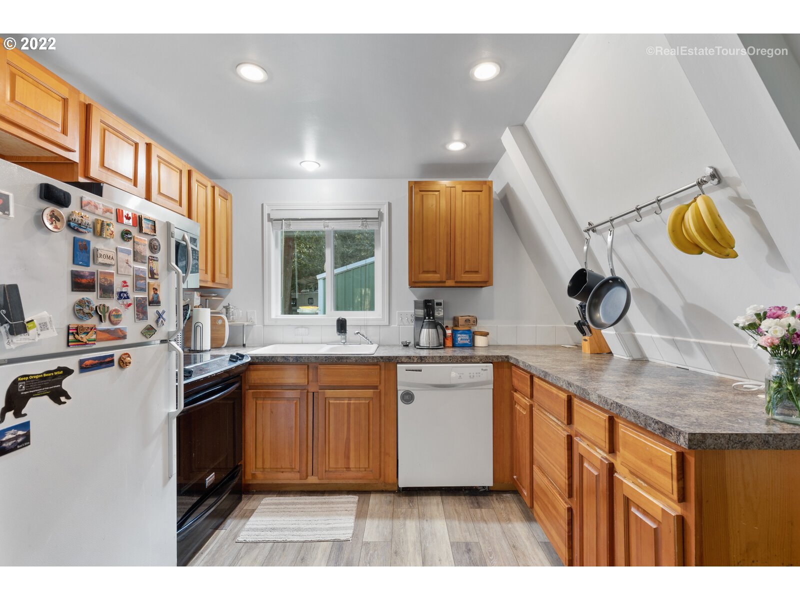 19465 Southeast Summertime Drive Sandy, OR 97055 - Photo 9 of 27 a kitchen with stainless steel appliances granite countertop a sink and cabinets