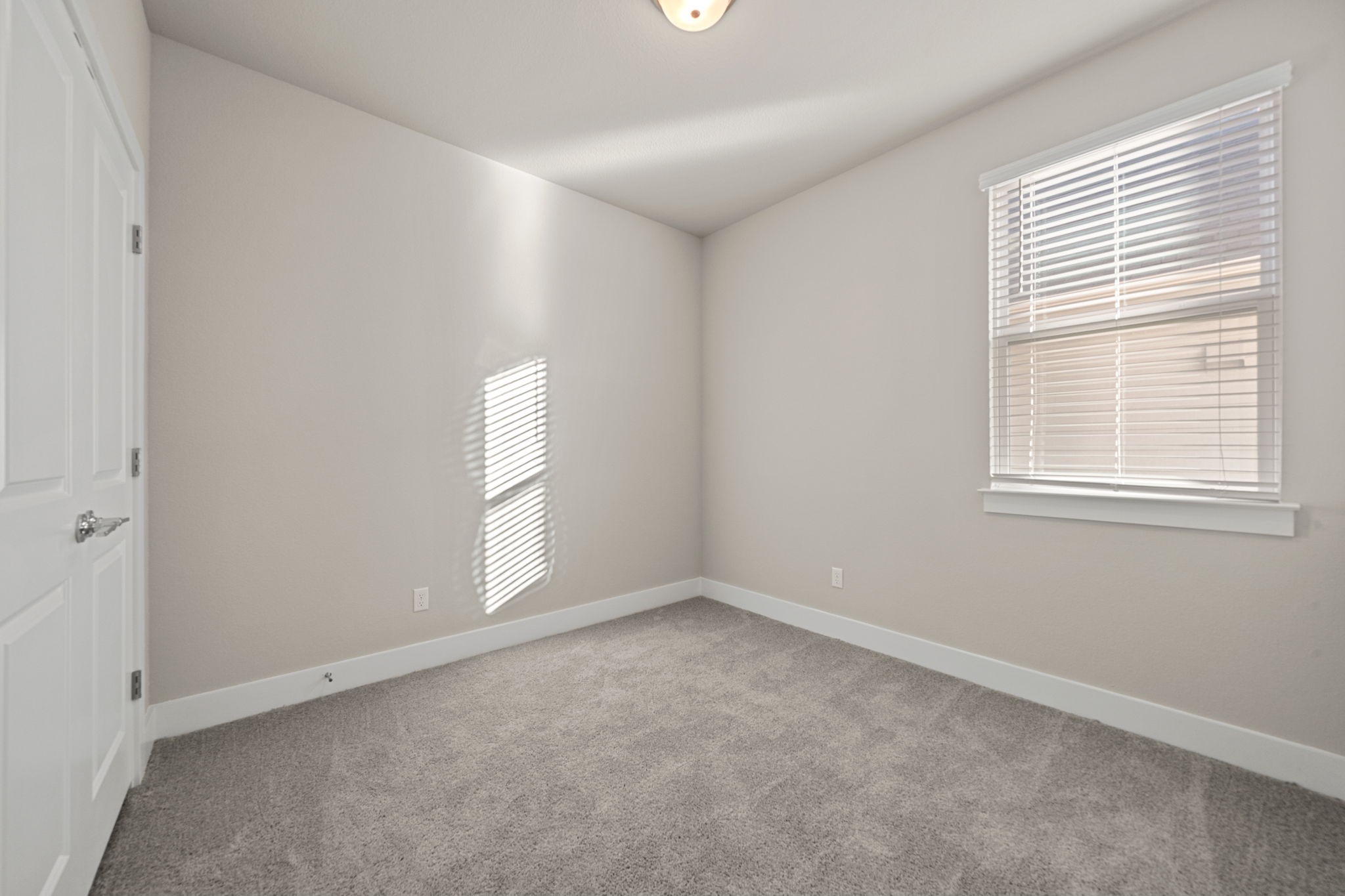 219 Pinnacle Lane Kyle, TX 78640 - Photo 7 of 20 an empty room with windows and closet