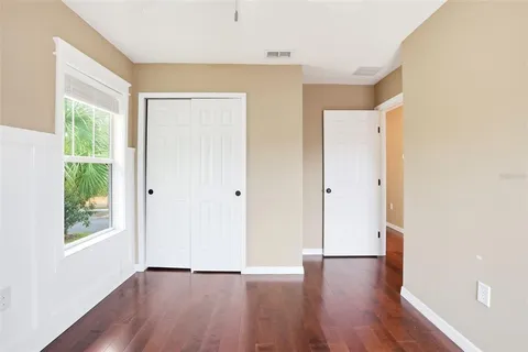 a bathroom with a toilet a sink and a large mirror