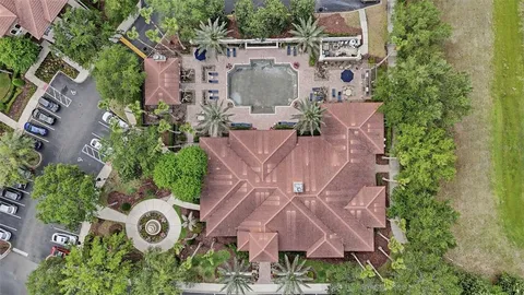 an aerial view of a house with a garden and plants