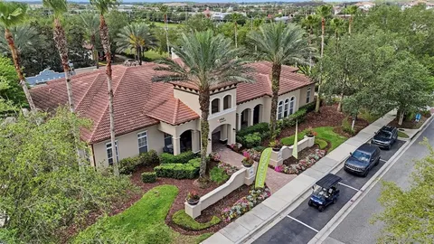 an aerial view of a house with a lake view