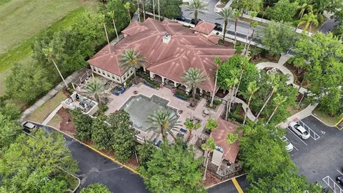 an aerial view of a houses with a lake view