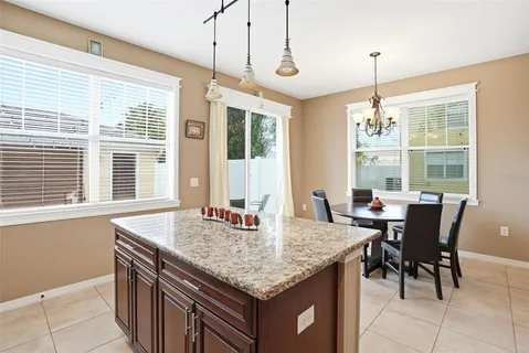 a view of a dining room with furniture window and outside view