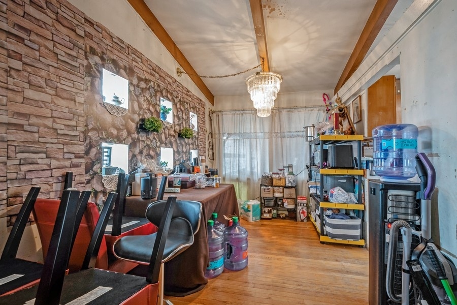 8645 Frontage Road Skokie, IL 60077 - Photo 3 of 13 a view of a dining room with furniture and chandelier