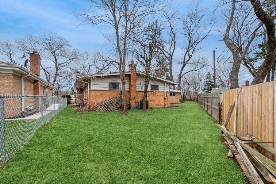 8645 Frontage Road Skokie, IL 60077 - Photo 9 of 13 a view of a house with backyard and sitting area