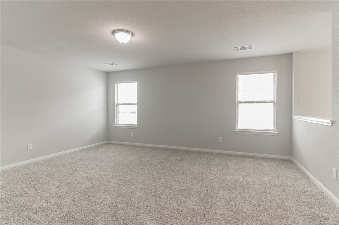 129 Wild Wind Trail Jarrell, TX 76537 - Photo 17 of 27 Another view of the upstairs family room.
Carpet has been removed andreplaced with luxury vinyl planks,