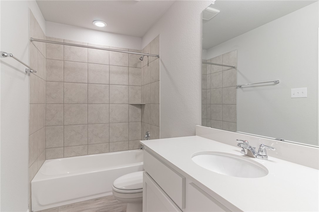 129 Wild Wind Trail Jarrell, TX 76537 - Photo 27 of 27 Bathroom #4 part of the ensuite in bedroom #4. There is also a walk in closet included in this ensuite. See floor plan in last picture for details.
