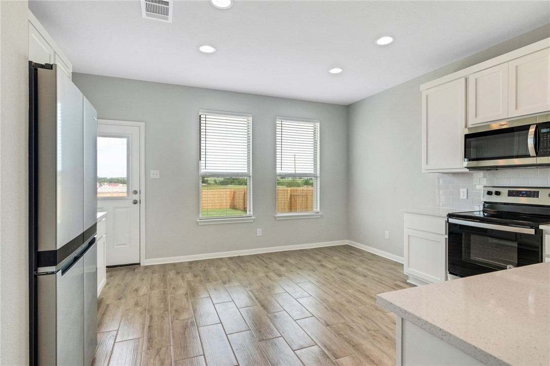 129 Wild Wind Trail Jarrell, TX 76537 - Photo 3 of 27 Spacious eat in kitchen.